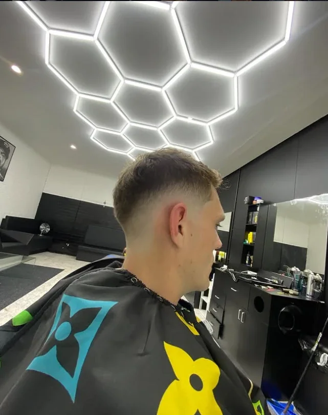 Fresh fade under the 54FADEZ hexagon lights